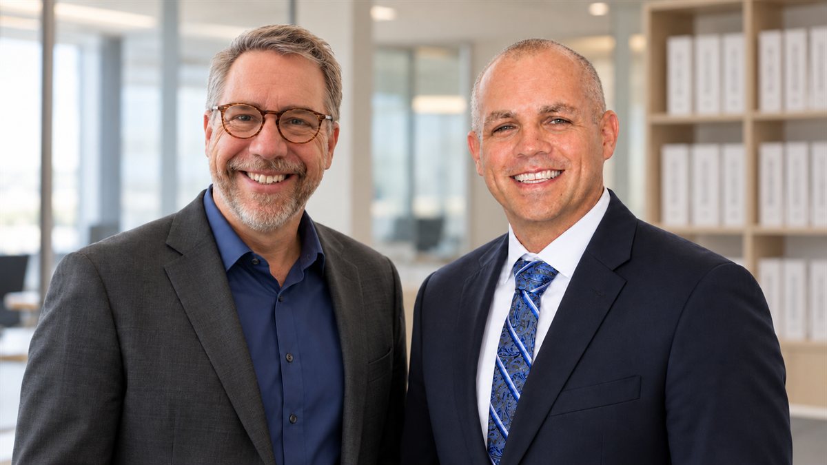 Kris Davis, President/Founder, and Mike Sooley, Account Development, in the Lit & More office